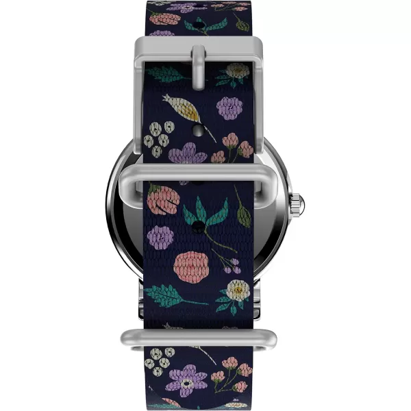 Timex Womens Watch Peanuts Weekender Casual Ladies Wristwatch  Featuring Snoopy and Woodstock in a Floral Motif SilverTone Case with Blue Fabric Strap 31mm