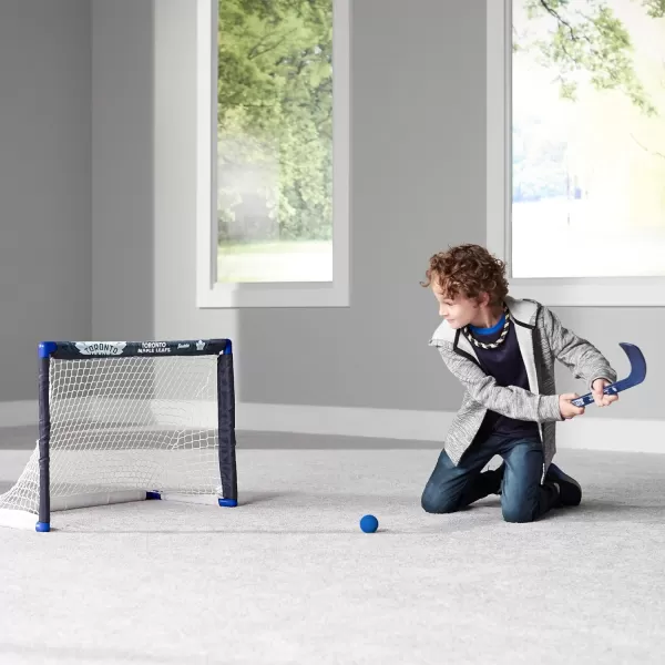 Franklin Sports NHL Mini Hockey Set  Kids Indoor Knee Hockey Goal Ball  2 Mini Hockey Stick Combo Set  Youth NHL Team Indoor Toy Knee Hockey Sets  NHL Official  Ages 3Toronto Maple Leafs