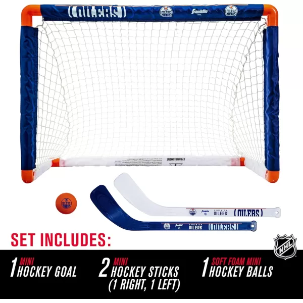Franklin Sports NHL Mini Hockey Set  Kids Indoor Knee Hockey Goal Ball  2 Mini Hockey Stick Combo Set  Youth NHL Team Indoor Toy Knee Hockey Sets  NHL Official  Ages 3Edmonton Oilers