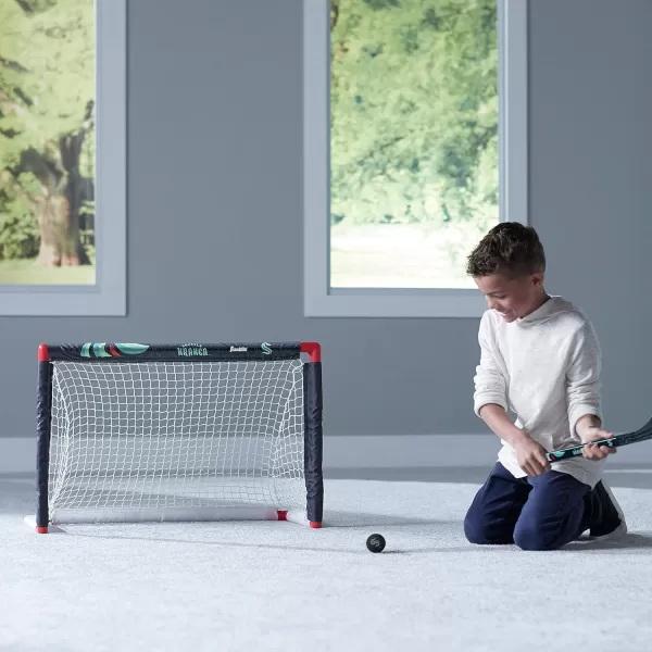 Franklin Sports NHL Mini Hockey Set  Kids Indoor Knee Hockey Goal Ball  2 Mini Hockey Stick Combo Set  Youth NHL Team Indoor Toy Knee Hockey Sets  NHL Official  Ages 3Seattle Kraken