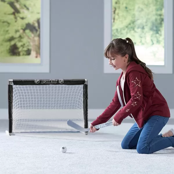 Franklin Sports NHL Youth Mini Hockey Goal  Stick Set  Kids Knee Hockey Goal Sticks  Foam Mini Balls  1 Goal 2 Mini Sticks  2 Balls Included