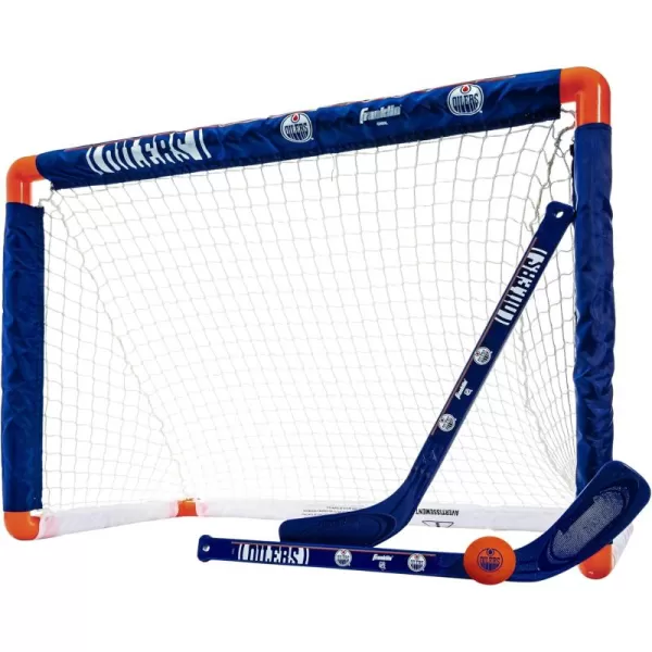 Franklin Sports NHL Mini Hockey Set  Kids Indoor Knee Hockey Goal Ball  2 Mini Hockey Stick Combo Set  Youth NHL Team Indoor Toy Knee Hockey Sets  NHL Official  Ages 3Edmonton Oilers