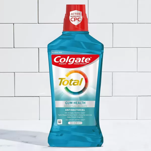 imageColgate Total Gum Health Alcohol Free Mouthwash Antibacterial Formula Helps Prevent Gingivitis Gum Disease Clean Mint  1L 338 fluid ounce 6 Pack338 Fl Oz Pack of 6