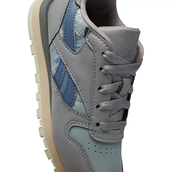 imageReebok Boys Classic Leather Sneaker Jurassic WorldGreyTeal FogBrave Blue 115 Little Kid