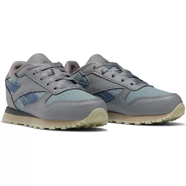 imageReebok Boys Classic Leather Sneaker Jurassic WorldGreyTeal FogBrave Blue 115 Little Kid