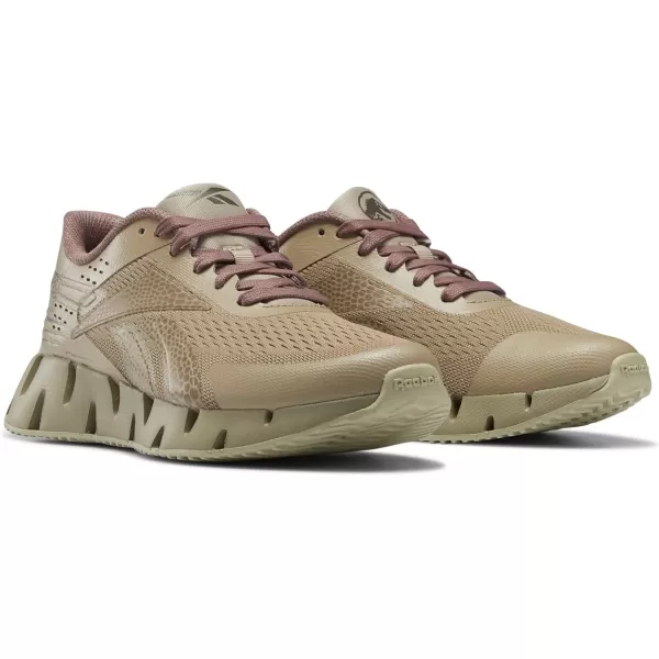 imageReebok Girls Zig Dynamica 20 Big KidJurassic WorldSand BeigeTaupe