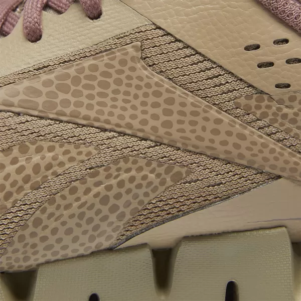 imageReebok Girls Zig Dynamica 20 Big KidJurassic WorldSand BeigeTaupe