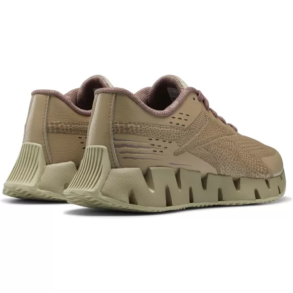 imageReebok Girls Zig Dynamica 20 Big KidJurassic WorldSand BeigeTaupe