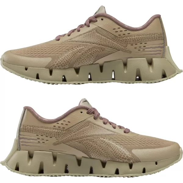 imageReebok Girls Zig Dynamica 20 Big KidJurassic WorldSand BeigeTaupe