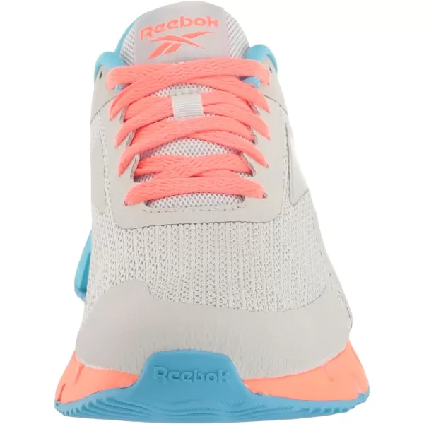 imageReebok Girls Zig Dynamica 20 Big KidPure GreyOrgflaRadiant Aqua