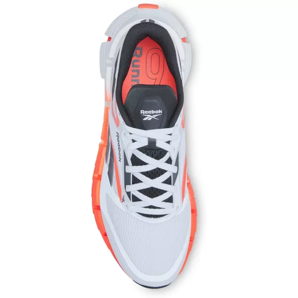 imageReebok Mens Floatzig 1 SneakerFootwear WhiteOrange FlareCore Black
