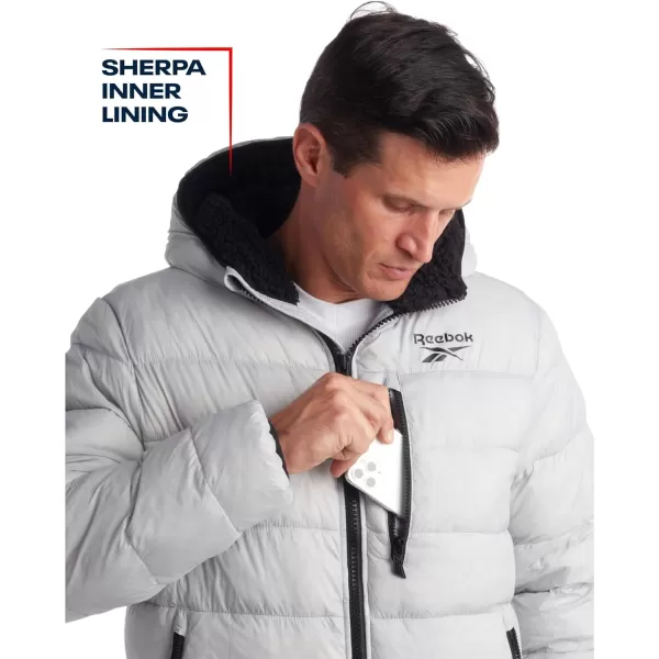 imageReebok Mens Winter Jacket  Heavyweight Quilted Puffer Parka Coat  Ski Jacket for Men Sherpa Lined Hood SXLPure Grey