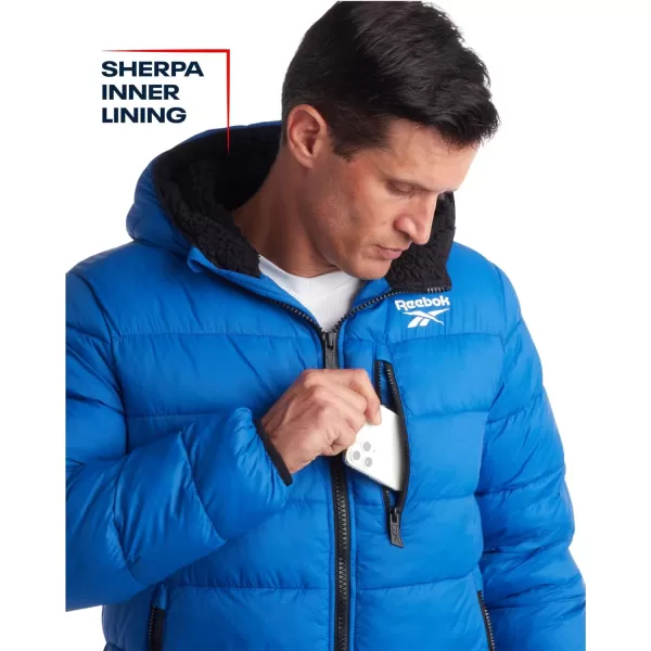 imageReebok Mens Winter Jacket  Heavyweight Quilted Puffer Parka Coat  Ski Jacket for Men Sherpa Lined Hood SXLVector Blue