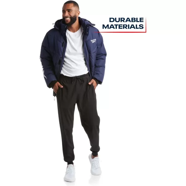 imageReebok Mens Winter Jacket  Heavyweight Quilted Puffer Parka Coat  Weather Resistant Ski Jacket for Men MXXLVector Navy