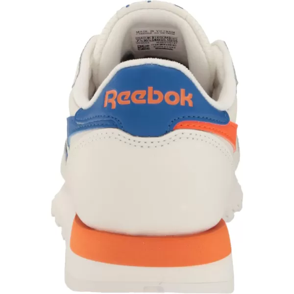 imageReebok Unisex Classic Leather SneakerChalkVector BlueSmash Orange