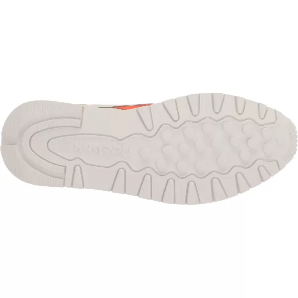 imageReebok Unisex Classic Leather SneakerChalkVector BlueSmash Orange