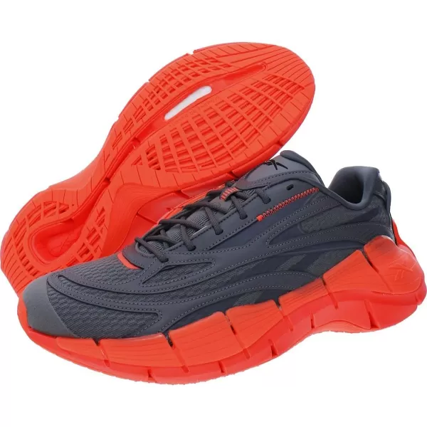 imageReebok UnisexAdult Zig Kinetica 25 SneakerPure GreyOrange Flare