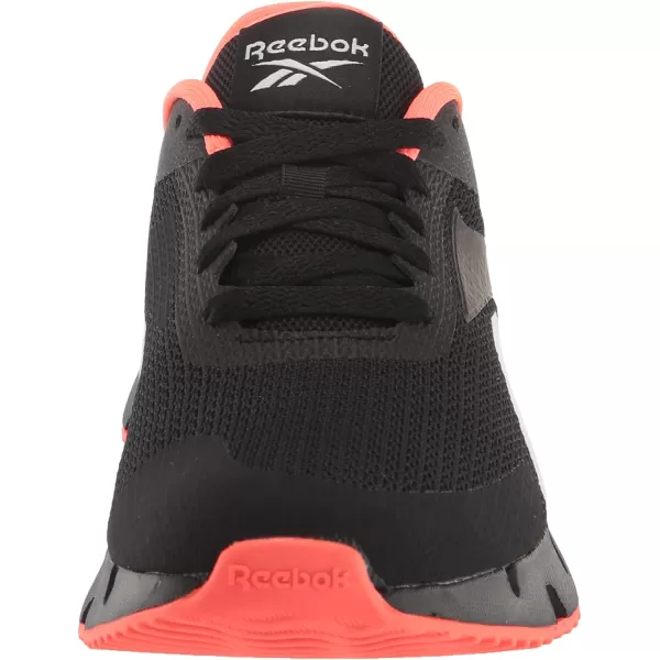 imageReebok UnisexChild Zig Dynamica 20 SneakerBlackOrange FlareWhite