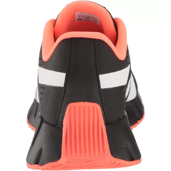 imageReebok UnisexChild Zig Dynamica 20 SneakerBlackOrange FlareWhite