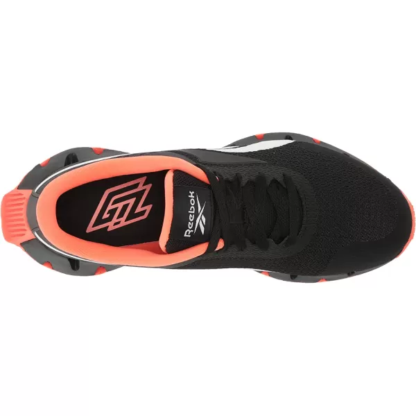 imageReebok UnisexChild Zig Dynamica 20 SneakerBlackOrange FlareWhite