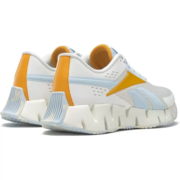 imageReebok UnisexChild Zig Dynamica 20 SneakerChalkGlass BlueSemi Solar Gold