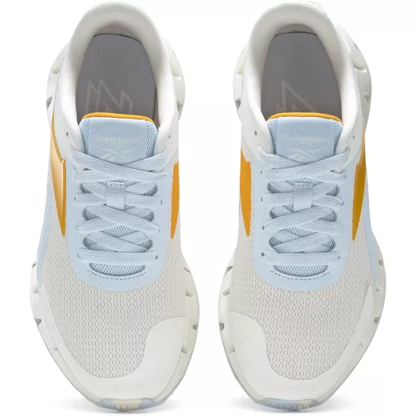 imageReebok UnisexChild Zig Dynamica 20 SneakerChalkGlass BlueSemi Solar Gold