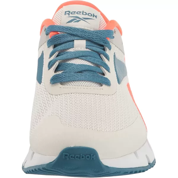 imageReebok UnisexChild Zig Dynamica 20 SneakerPure GreyOrange FlareSteely Blue