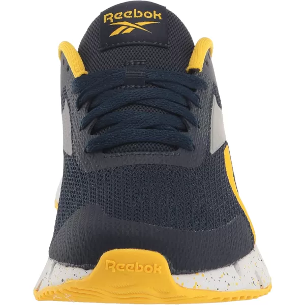 imageReebok UnisexChild Zig Dynamica 20 SneakerVector NavyAlways YellowPure Grey