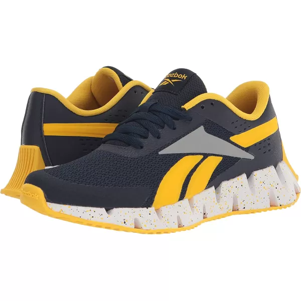 imageReebok UnisexChild Zig Dynamica 20 SneakerVector NavyAlways YellowPure Grey