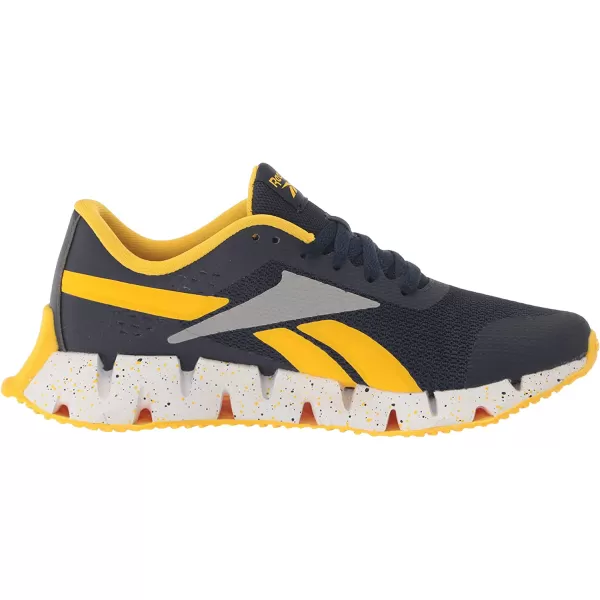 imageReebok UnisexChild Zig Dynamica 20 SneakerVector NavyAlways YellowPure Grey