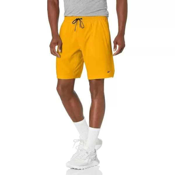 imageReebok Mens Standard Workout Ready Woven ShortsSemi Solar Gold