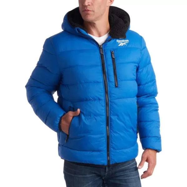 imageReebok Mens Winter Jacket  Heavyweight Quilted Puffer Parka Coat  Ski Jacket for Men Sherpa Lined Hood SXLVector Blue