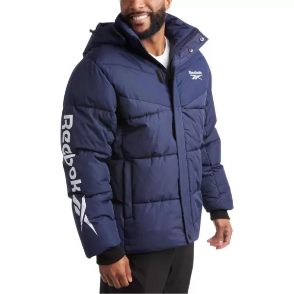 imageReebok Mens Winter Jacket  Heavyweight Quilted Puffer Parka Coat  Weather Resistant Ski Jacket for Men MXXLVector Navy