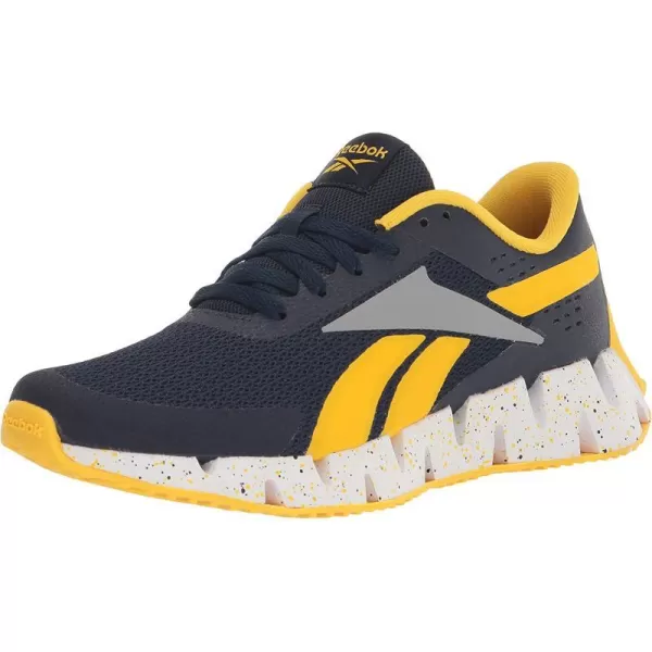 imageReebok UnisexChild Zig Dynamica 20 SneakerVector NavyAlways YellowPure Grey