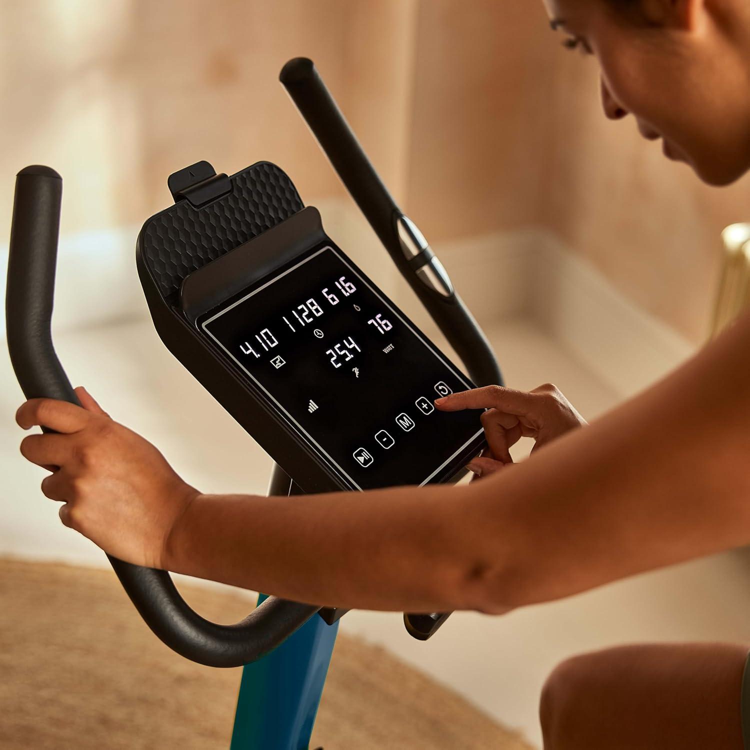 imageReebok Fitness Stationary Bike Bluetooth Compatible Indoor Cycling Bike 24 Resistance Levels 12 Workouts Upright Exercise Bike with Gel Pad SaddleGreen