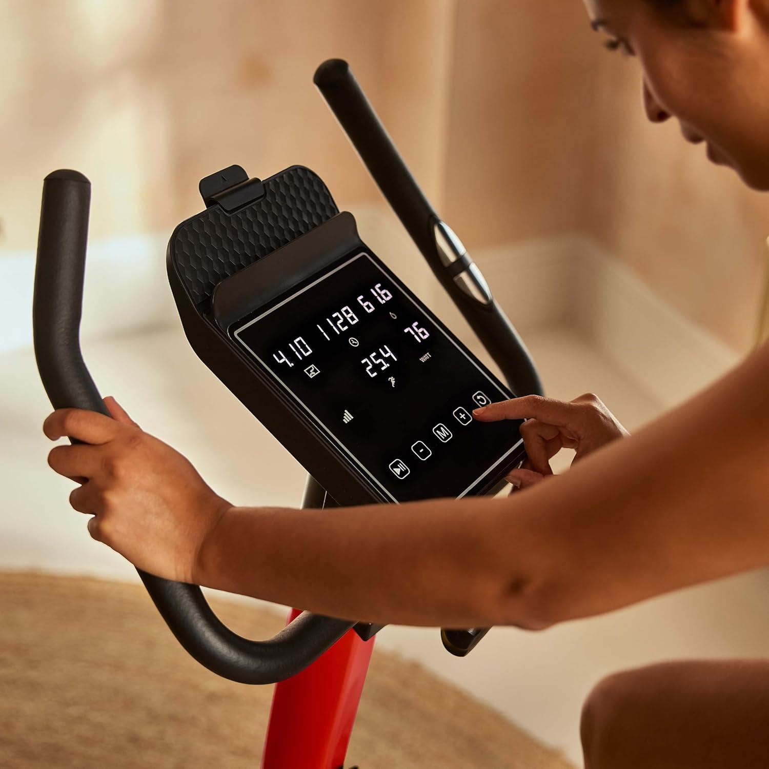 imageReebok Fitness Stationary Bike Bluetooth Compatible Indoor Cycling Bike 24 Resistance Levels 12 Workouts Upright Exercise Bike with Gel Pad SaddleRed