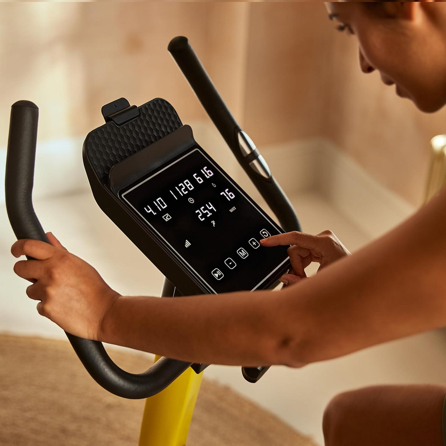 imageReebok Fitness Stationary Bike Bluetooth Compatible Indoor Cycling Bike 24 Resistance Levels 12 Workouts Upright Exercise Bike with Gel Pad SaddleYellow