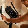 imageReebok Fitness Stationary Bike Bluetooth Compatible Indoor Cycling Bike 24 Resistance Levels 12 Workouts Upright Exercise Bike with Gel Pad SaddleBlackFR30