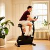 imageReebok Fitness Stationary Bike Bluetooth Compatible Indoor Cycling Bike 24 Resistance Levels 12 Workouts Upright Exercise Bike with Gel Pad SaddleBlackFR20