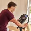 imageReebok Fitness Stationary Bike Bluetooth Compatible Indoor Cycling Bike 24 Resistance Levels 12 Workouts Upright Exercise Bike with Gel Pad SaddleBlackFR30
