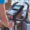 imageReebok Fitness Stationary Bike Bluetooth Compatible Indoor Cycling Bike 24 Resistance Levels 12 Workouts Upright Exercise Bike with Gel Pad SaddleBlack