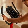 imageReebok Fitness Stationary Bike Bluetooth Compatible Indoor Cycling Bike 24 Resistance Levels 12 Workouts Upright Exercise Bike with Gel Pad SaddleRed