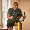 imageReebok Fitness Stationary Bike Bluetooth Compatible Indoor Cycling Bike 24 Resistance Levels 12 Workouts Upright Exercise Bike with Gel Pad SaddleYellow