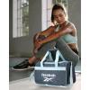 imageReebok Duffle Bag  Carry On Gym Bag for Workout and Travel Duffel Bags  Small Size Overnight Bags for Women and Men Size Small Aleph BlueWarrior II Medium Grey